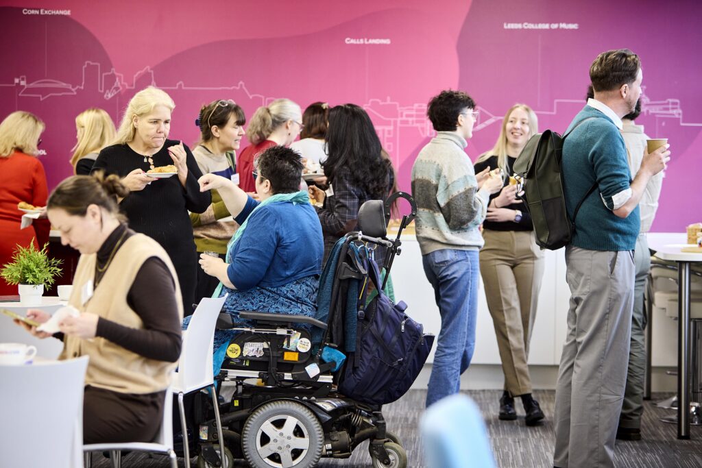 Conference attendees chat over lunch